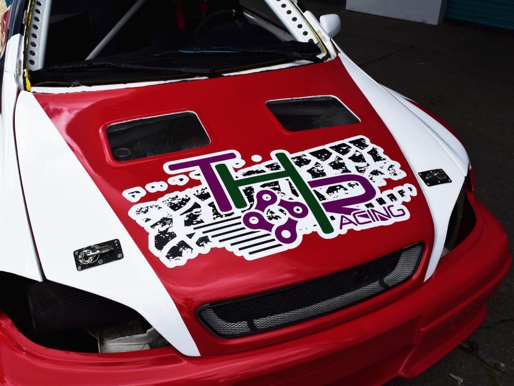 Branded vinyl graphics on bonnet of Vauxhall Astra company car.