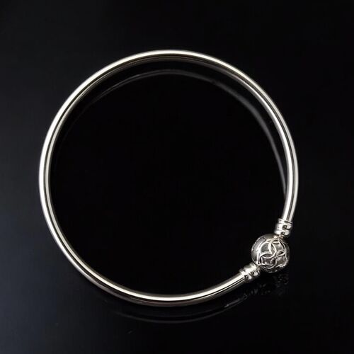 Silver stacking bangle with orb clasp