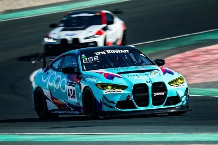 BMW M4 GT4 with motorsport livery and graphics on race track.