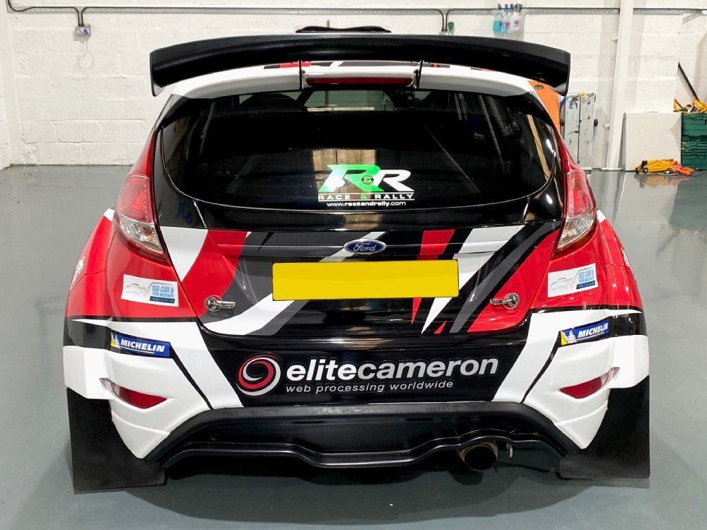 Race decals installed on rear end of a Ford Fiesta R5 rally car