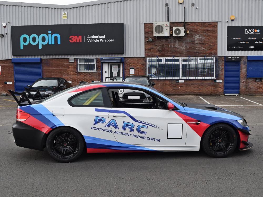 Bespoke branded company car wrap and graphics on a BMW M3 outside Popin in Cardiff.