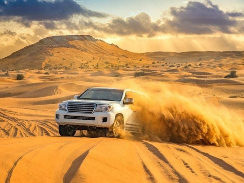 Evening Red Dune Desert Safari with Quad Bike | Desert Tigers Tourism L.L.C | Dubai Safari 4x4 Tour Packages | Dubai Safari Quad Bike Tours | Dubai City Tours Camel Rides