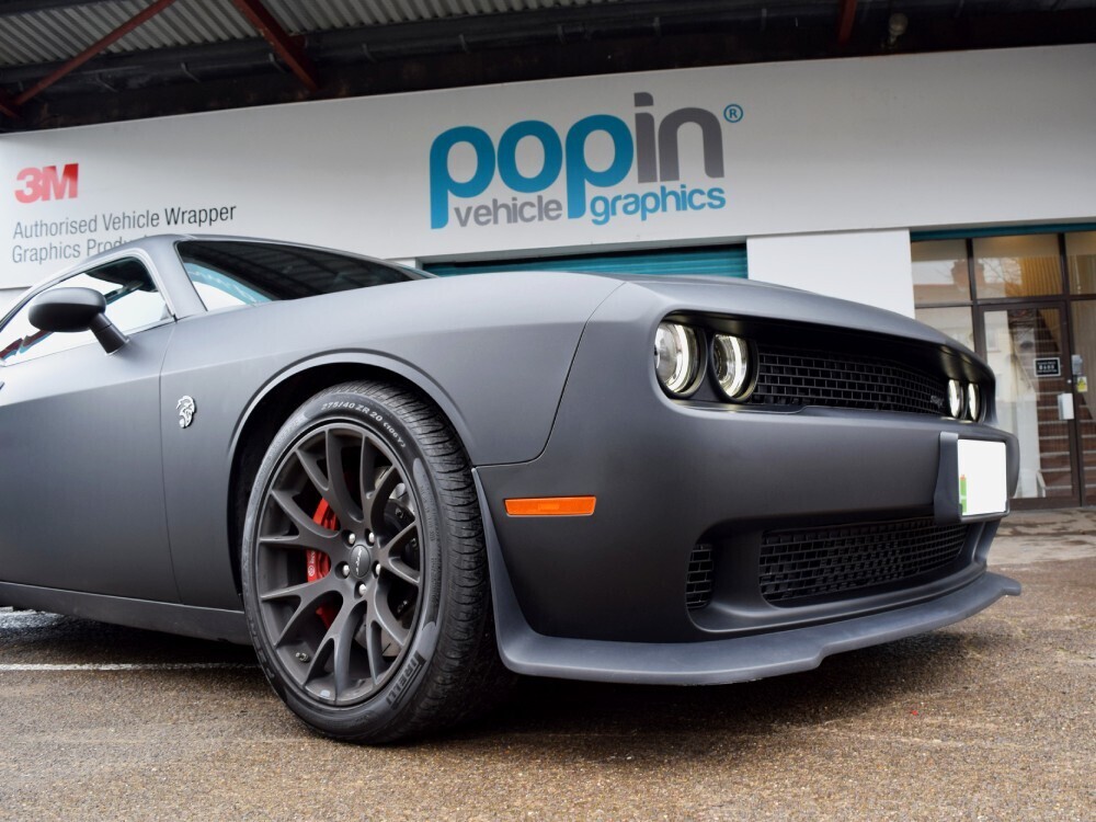 Front end of a Dodge Challenger Hellcat with matte motorsport livery