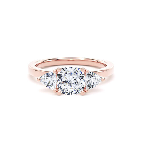 Cushion and trilliant cut diamond trilogy ring