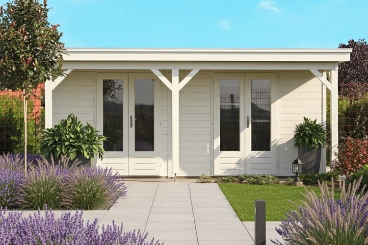 A contemporary wooden log cabin with large windows and double doors, nestled in a grassy yard. The sky is clear and blue with trees visible in the background, offering a perfect retreat for cosy accommodation.