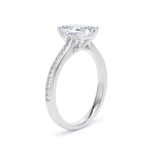 Emerald cut solitaire with channel set diamond shoulders
