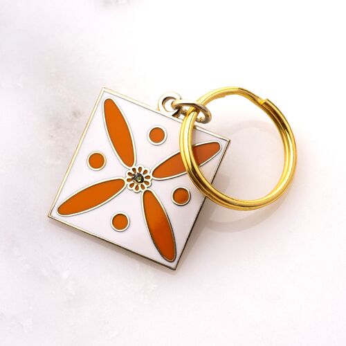 Charm. The Persian Cross. Orange on White with 1 Central Green Stone.