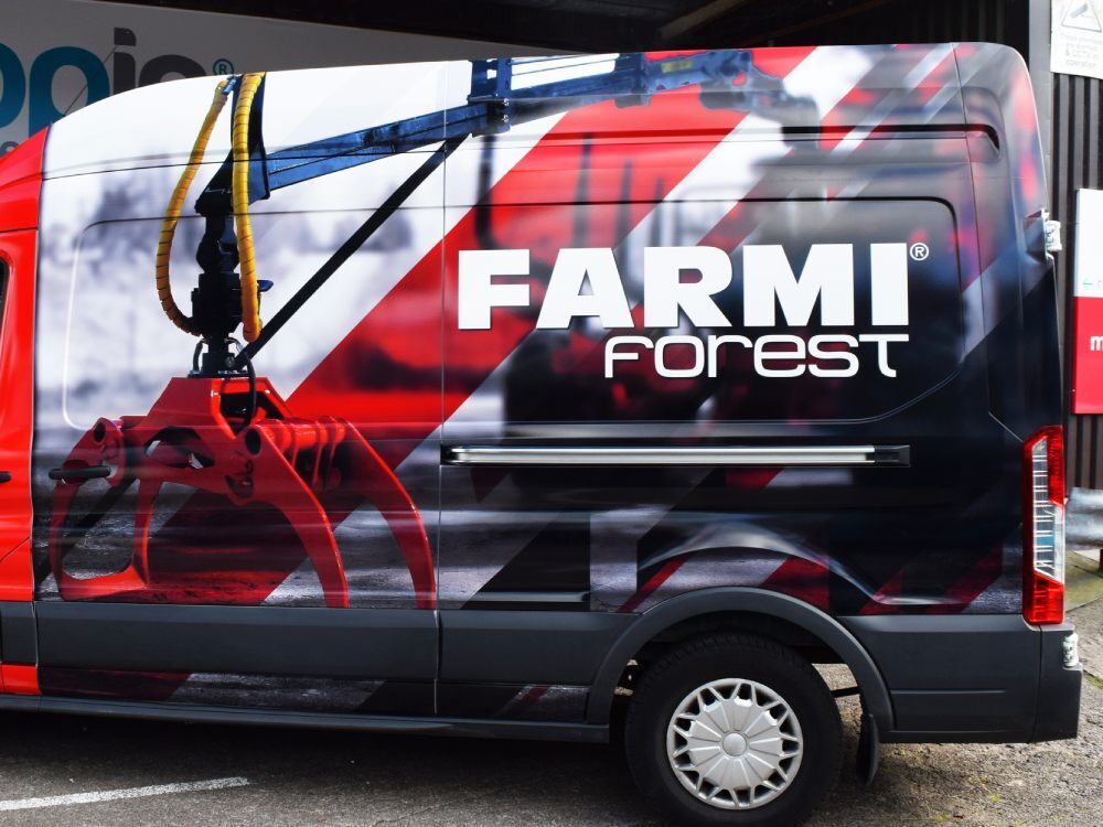 Bold full vehicle wrap on a company Ford Transit van.