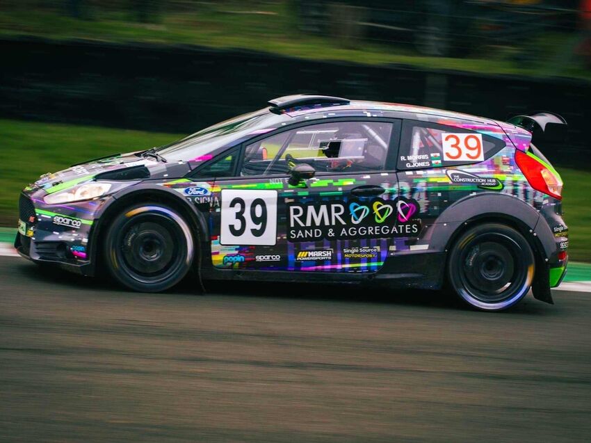 Bold and colourful motorsport livery with race strategically placed car sponsor logo graphics.