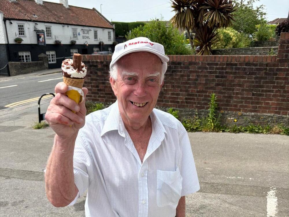 Elderly gent enjoying his trip to the shop for an ice cream in the heatwave at Your Care's Dementia Day Centre in Bristol