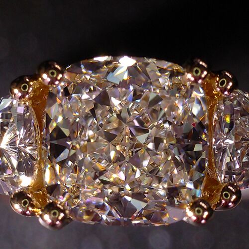 Cushion and trilliant cut trilogy ring