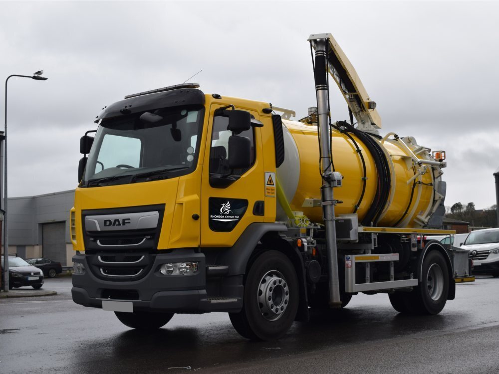 DAF LF Gully vehicle with yellow vinyl wrap.