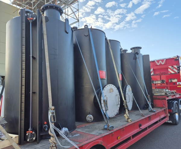 Four bulk storage tanks en route to a water treatment works