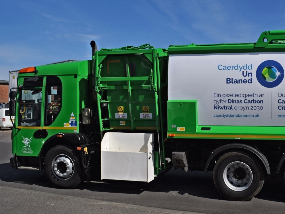 Green vehicle livery on a Dennis truck.