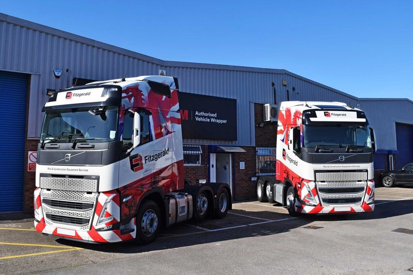 Professional matching vehicle livery and graphics on fleet of company trucks.