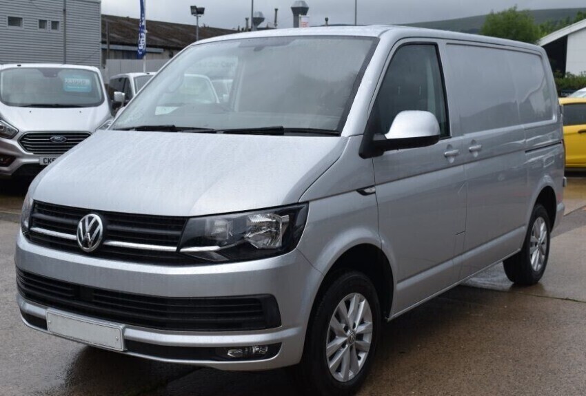 A silver leased company van before a vinyl wrap installation.