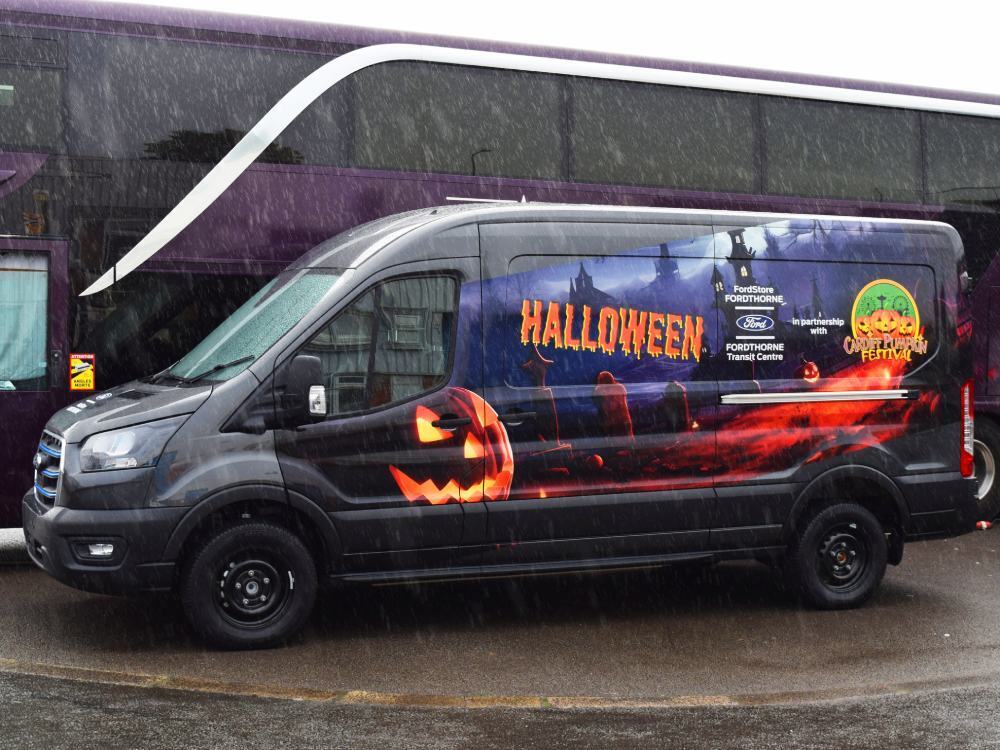 Ford E-Transit electric company van with promotional Halloween themed livery.