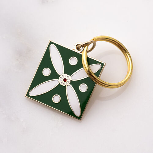 Charm. The Persian Cross. White on Green with 1 Central Red Stone.