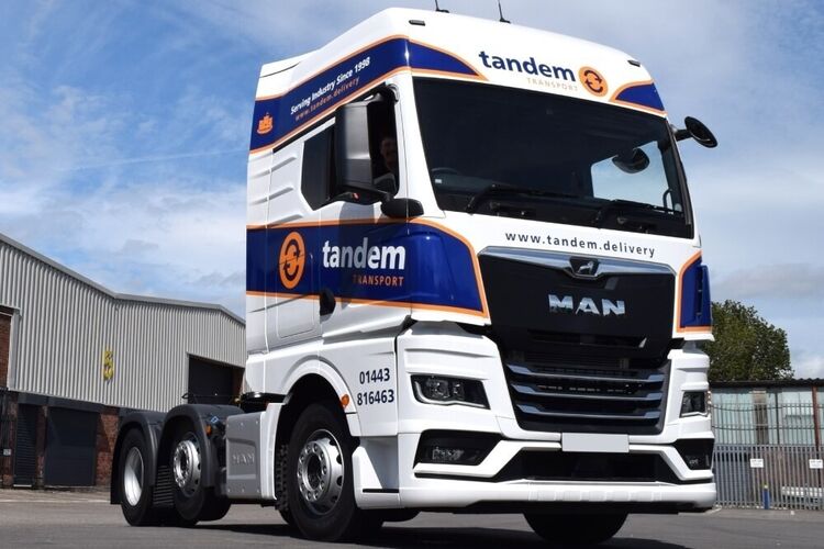 MAN lorry with newly installed branded vehicle wrap and vinyl graphics.