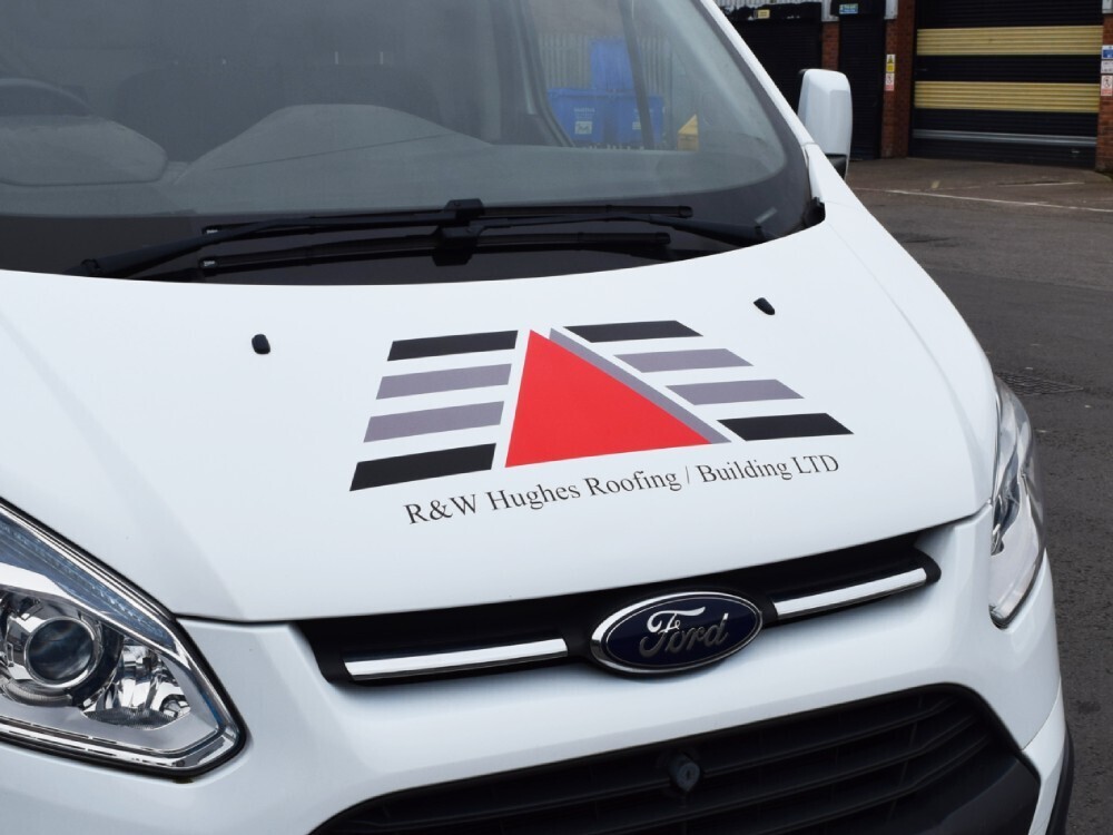 Branded company vehicle graphics on a white Ford Transit Custom van.