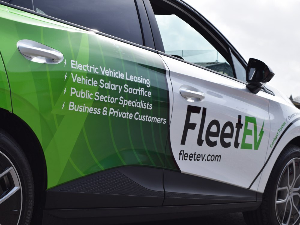 Promotional FleetEV vehicle wrap on MG4 Trophy Long Range electric company car.