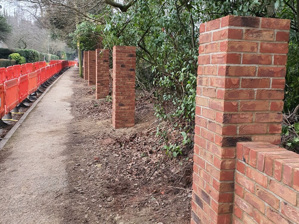 150 metre Boundary Brickwork Wall and 285 sqm Block Paving. Special piling and steelwork design provisions taken to protect TPO tree roots.