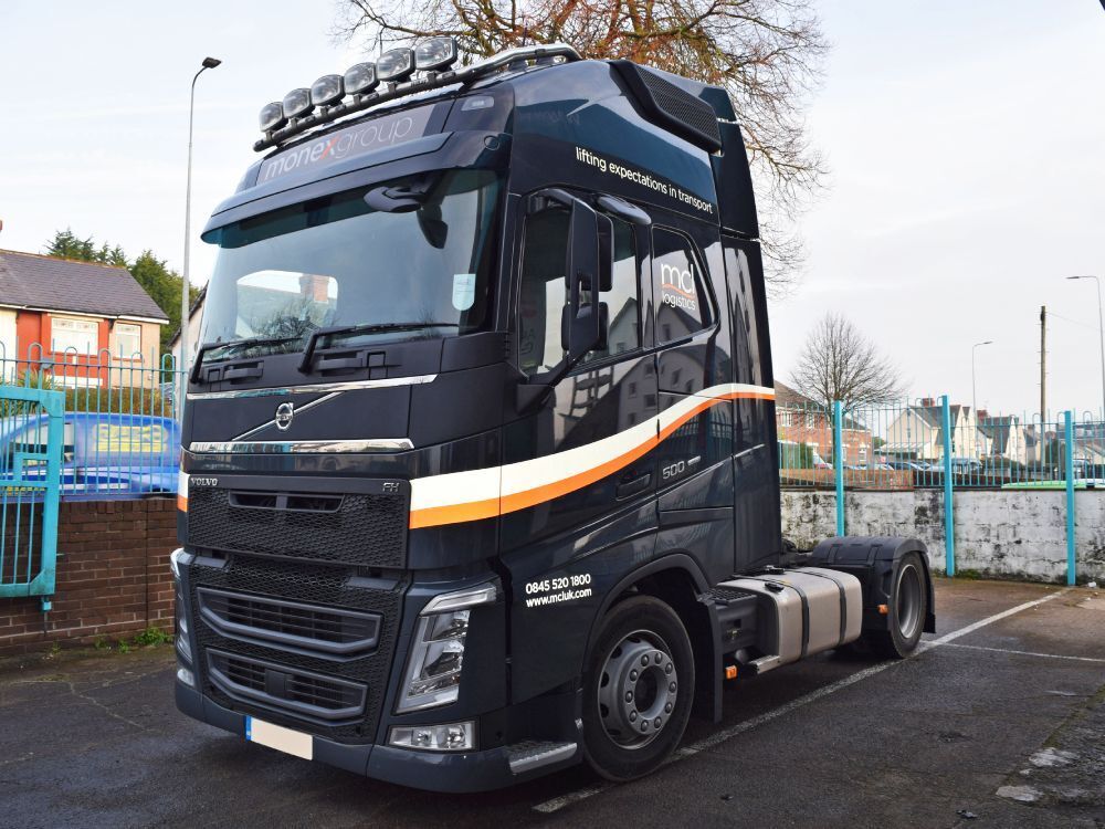 Vehicle wrap and vinyl graphics newly installed on a Volvo lorry cab.