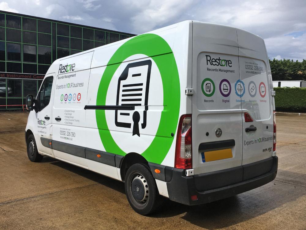 Vehicle vinyl graphics on white company Vauxhall Movano van.