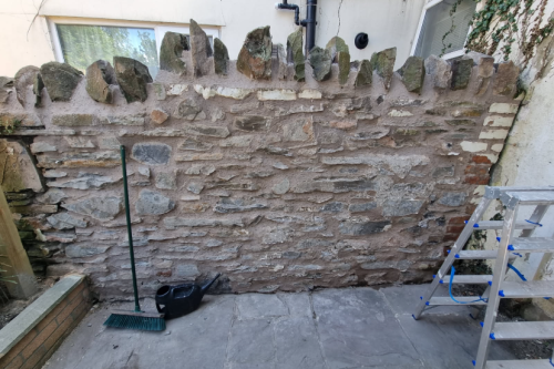 Stone wall repair and fence renewal.