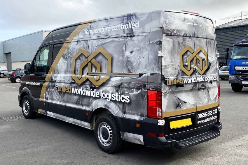 Large business van with full vehicle wrap branding.