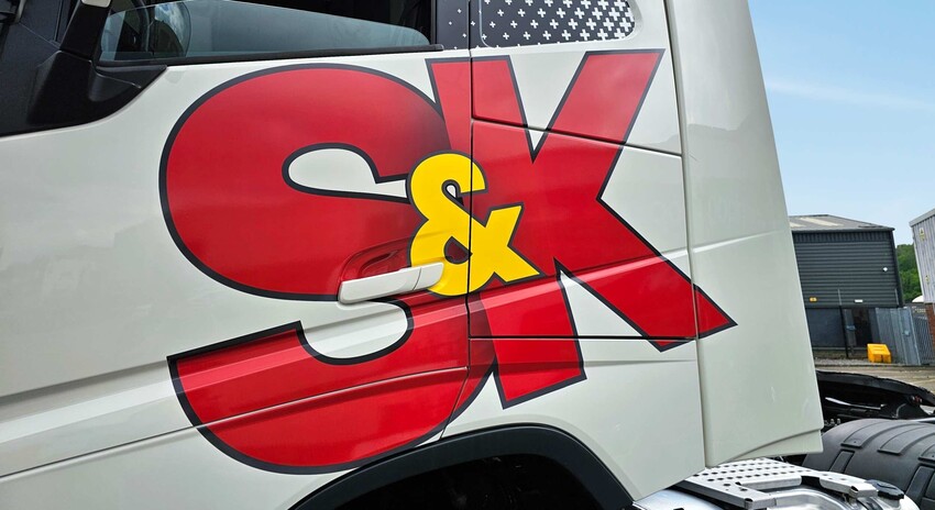 Vinyl graphics applied to truck door with business logo