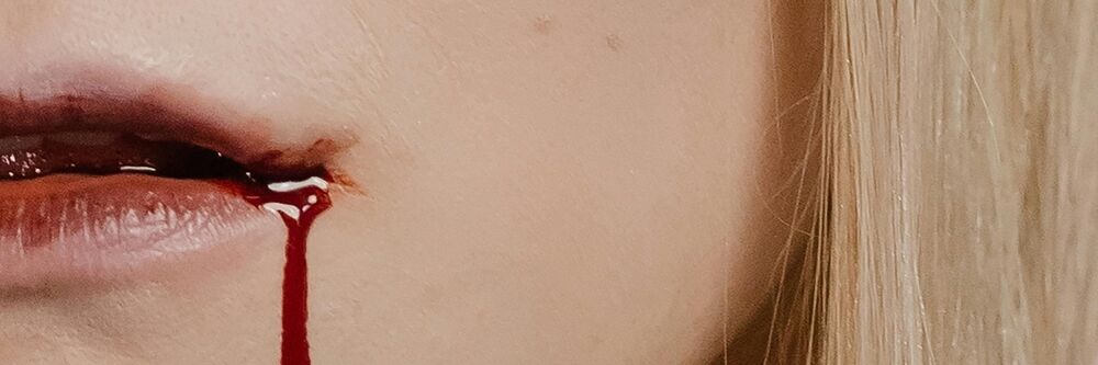 Girl with blood coming out of her mind like a vampire