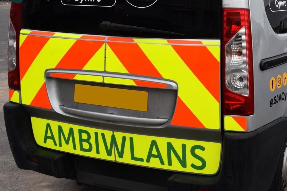 Chapter 8 safety chevron marking vinyl graphics installed on rear of St John's ambulance van.