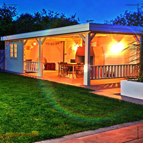 A partitioned gazebo with protective walling, wood effect porcelain floor and open stone fire and chimnea