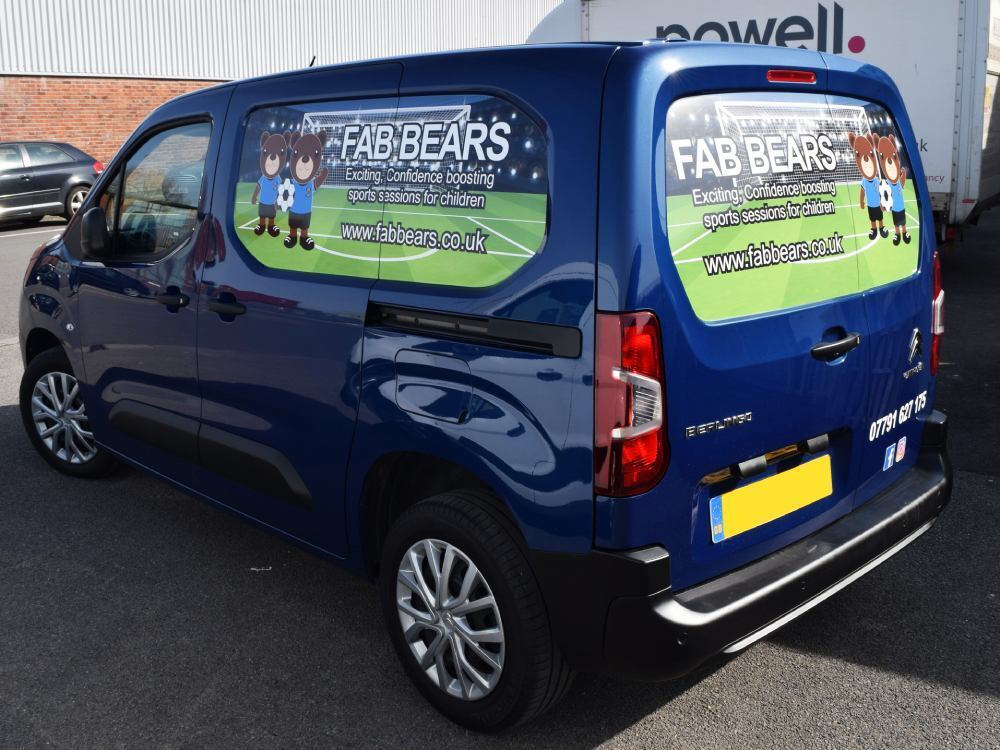 Infilled graphic panels with branded design on a company's Citroen Berlingo van.