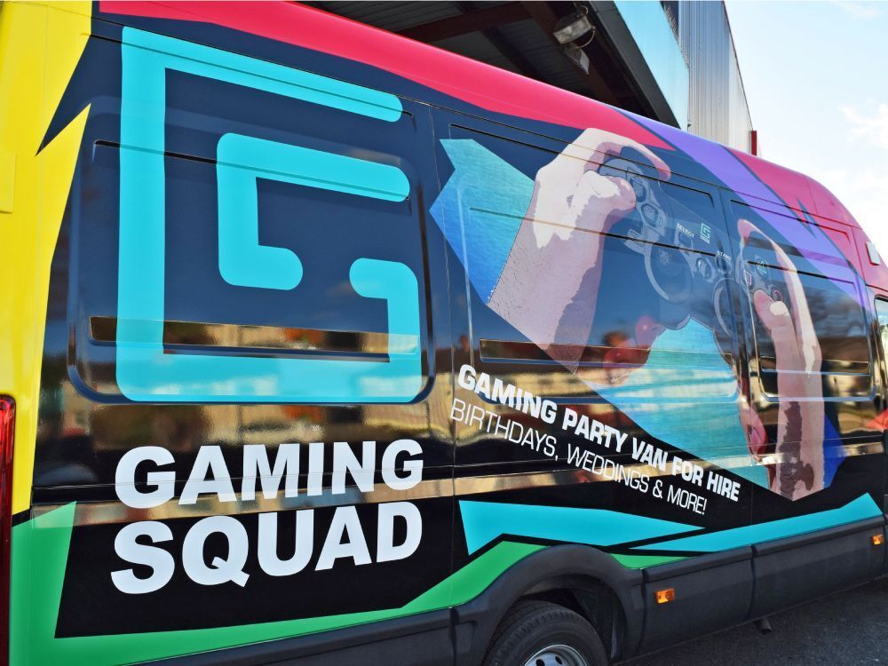 Close up of Gaming Squad colourful and bright branded vehicle wrap on company Iveco Daily van.