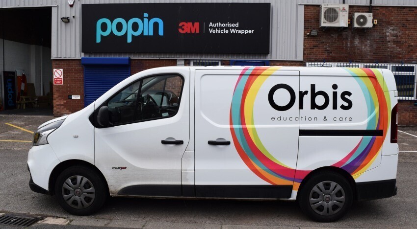 Fiat Talento company van with branded vehicle graphics outside Popin in Cardiff.