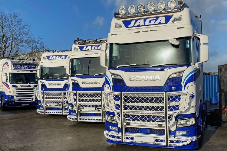 Fleet of trucks with matching vehicle wraps and graphics.