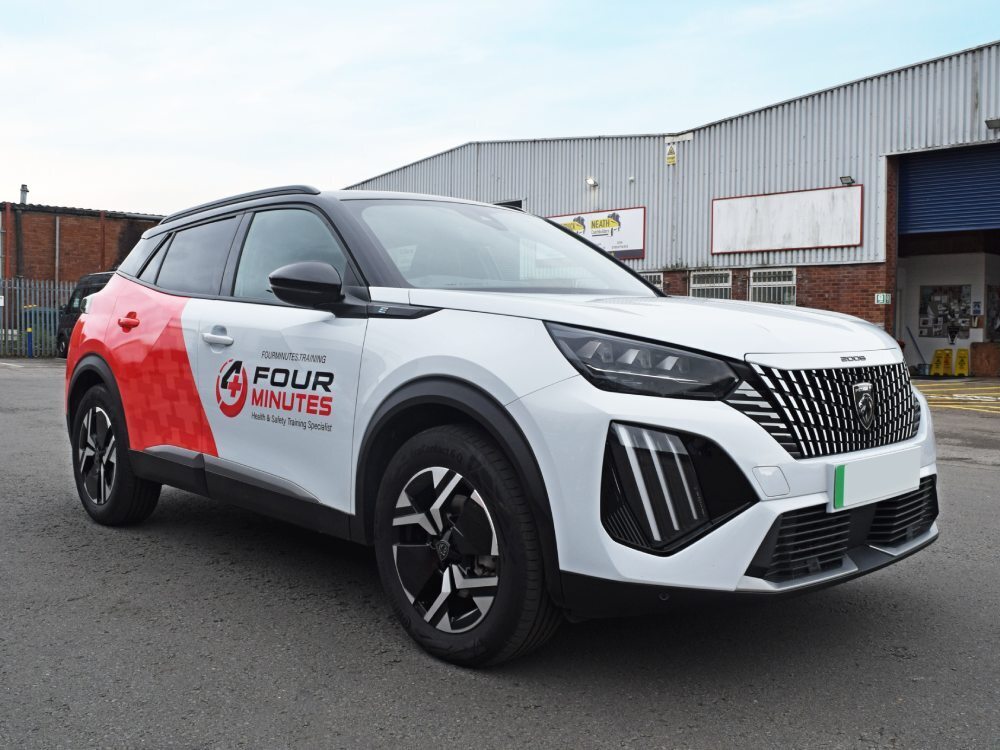 Partial wrap and graphics on Peugeot 2008 company car.