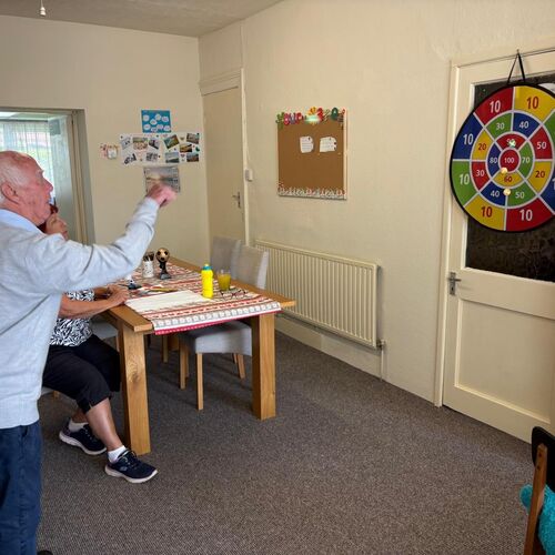 Elderly gent playing target games at Your Care's Dementia Day Club in Hanham, Bristol