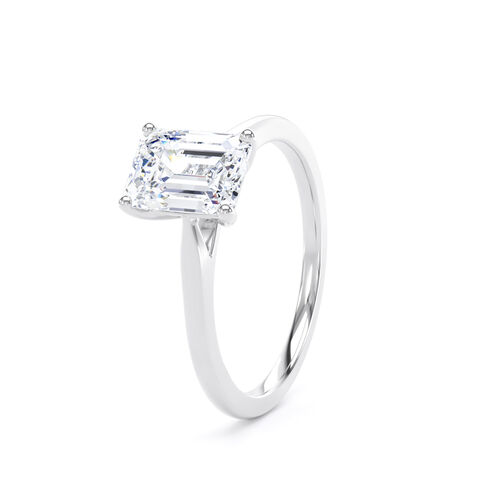 Emerald cut solitaire with diamond set shoulders