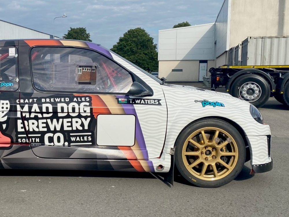 Race graphics and livery on front end of Renault Clio V6 sports car