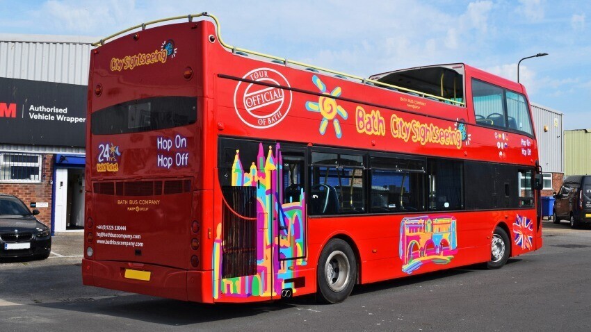Bath City Sightseeing branded vinyl graphics on red Optare VLE open top tour bus.