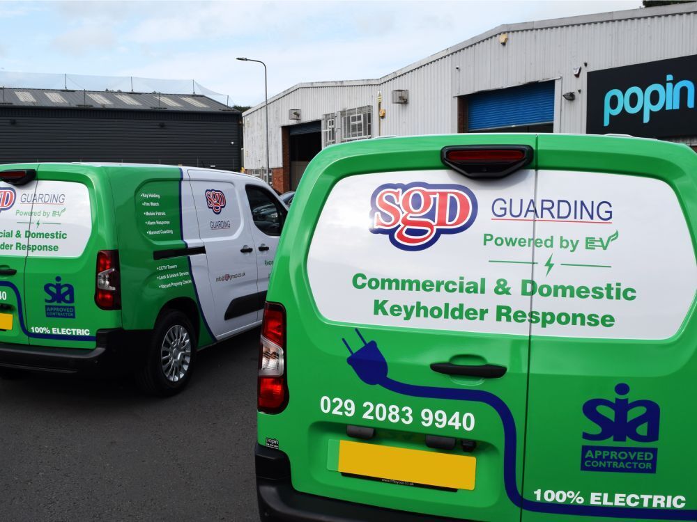 EV promotional wrap and graphics on fleet of company Toyota Proace City Verso electric vans outside Popin in Cardiff.