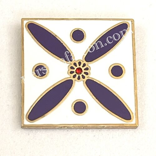 Badge. The Persian Cross. Purple Cross on White with Central Red stone.