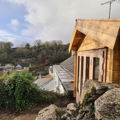 A bespoke library garden building with bi-fold doors and a fantastic view