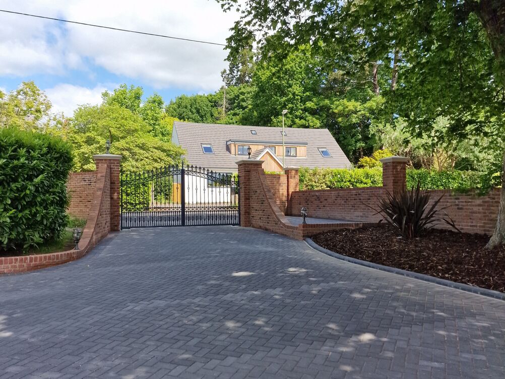 150 metre Boundary Brickwork Wall and 285 sqm Block Paving. Special piling and steelwork design provisions taken to protect TPO tree roots.
