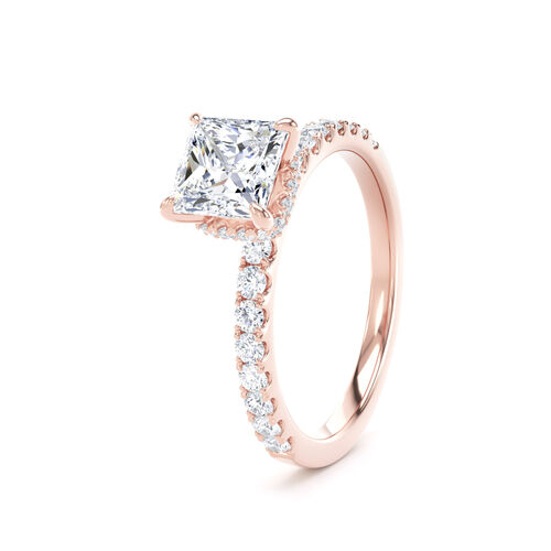 Princess cut solitaire with diamond shoulders and hidden halo