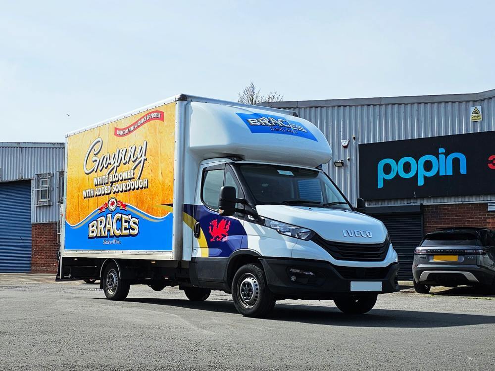 Brace's Bread company branded vehicle wrap on an Iveco Daily Luton Box van outside Popin in Cardiff.