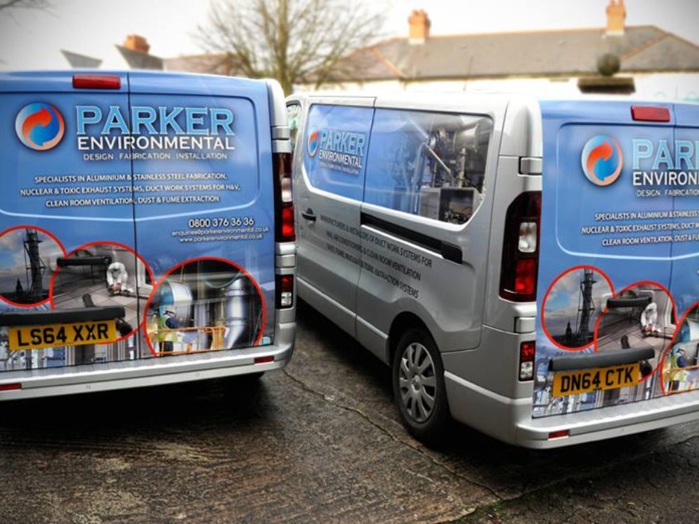 Fleet of company vans with branded graphics.